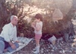 Orhan Arı with his first grandchild, Oben. 1980s.